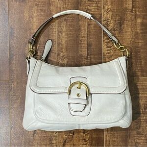 Coach cream leather shoulder bag with gold buckle